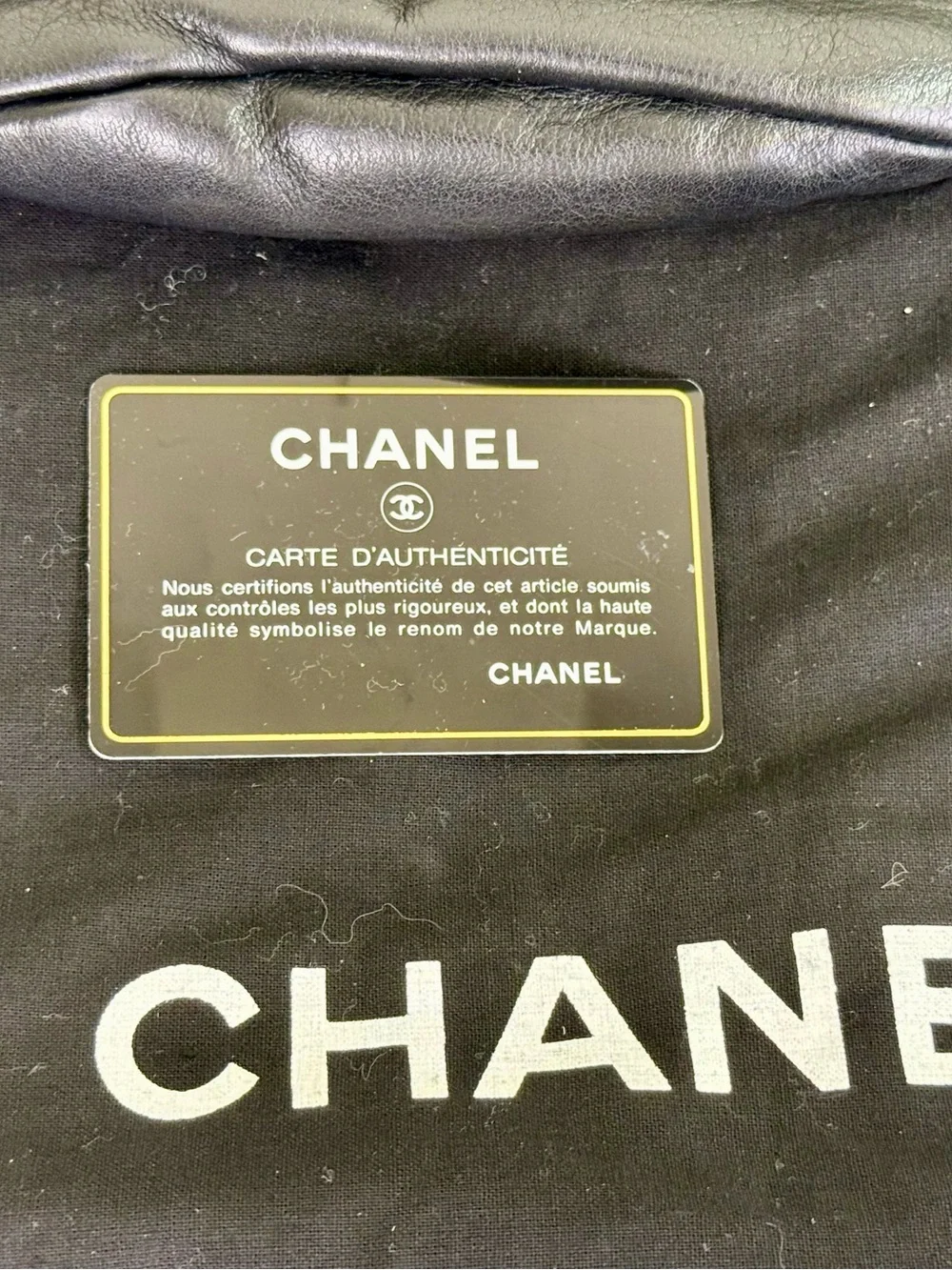 CHANEL CC LOGO BUCKET BAG IN BLACK LAMBSKIN LEATHER